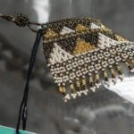 Close-up of Sol Dorado hand-beaded choker craftsmanship
