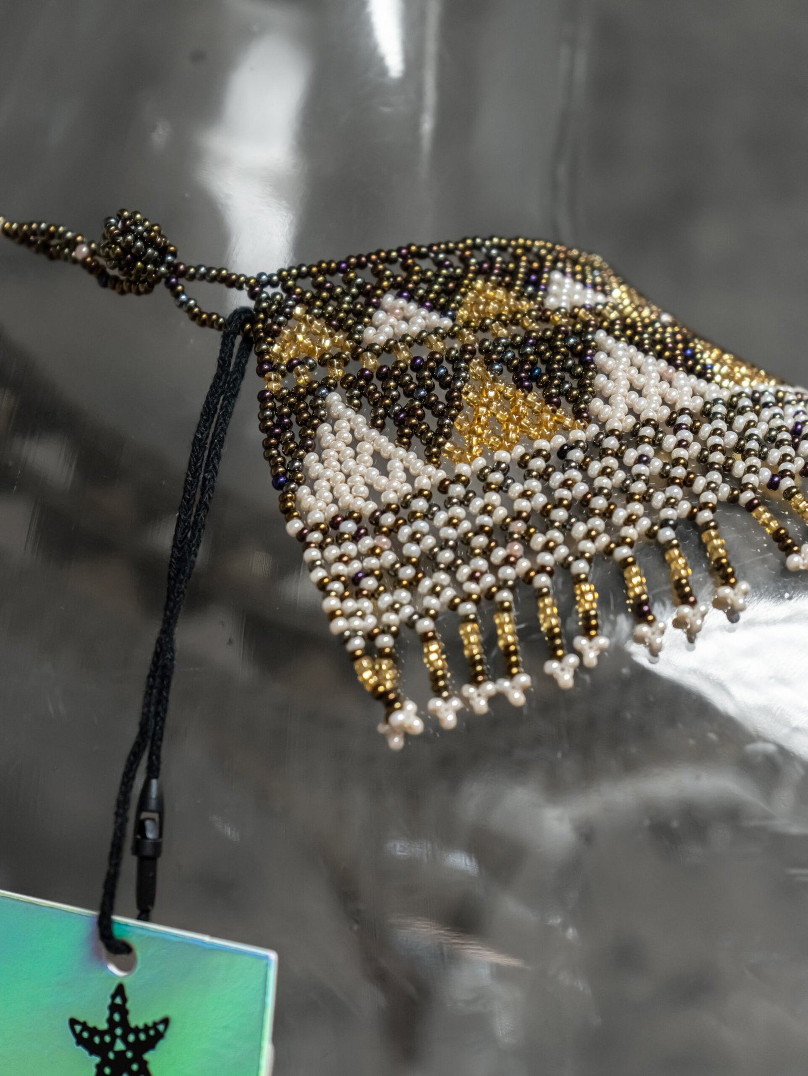 Close-up of Sol Dorado hand-beaded choker craftsmanship